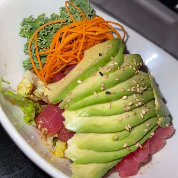 Bonsai Thai & Sushi's tuna poke bowl with avocado, shredded carrots, and sesame seeds.