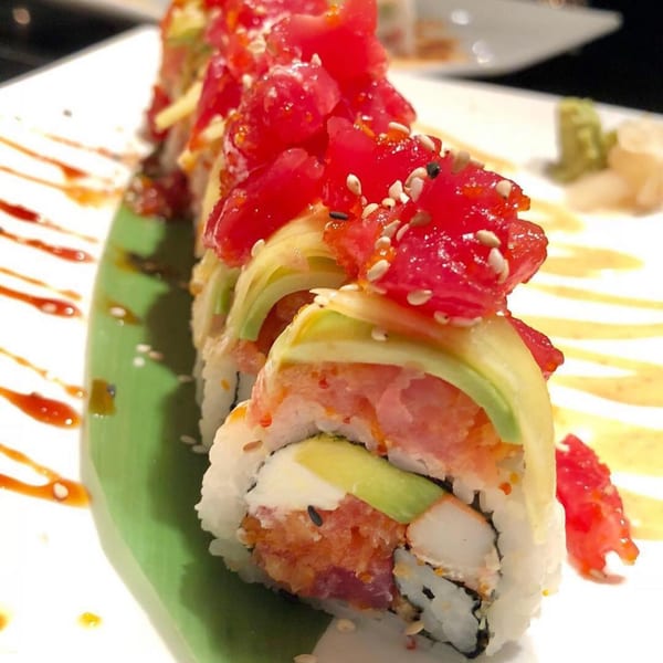 Bonsai Thai & Sushi's vibrant sushi roll topped with diced tuna, avocado, and sesame seeds.